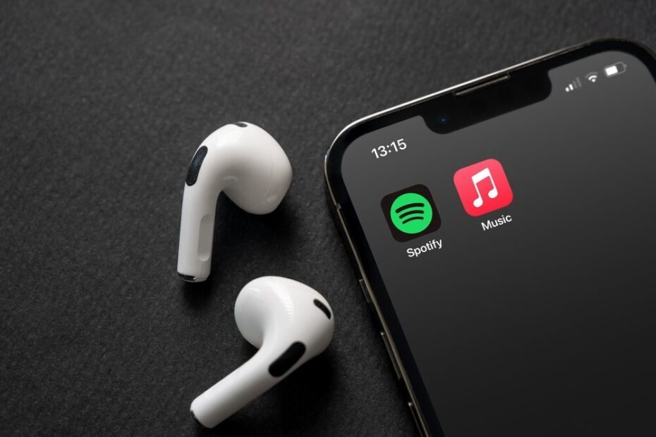Logo di Apple Music e Spotify